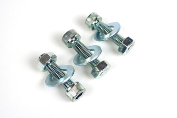 several bolts made of metal with nuts screwed on them