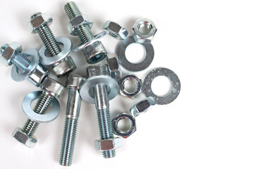 on a white background galvanized metal fasteners close up