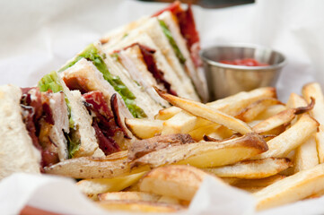 clubhouse sandwich with fries