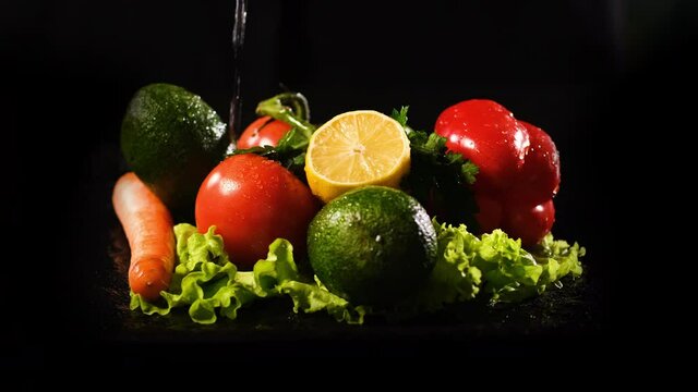 Washing Fresh Vegetables for Salad by Black Background by the Black Background. Healthy Lifestyle, Vegetarian Food and Dieting Concept