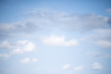 Beautiful sky background. Light blue and gray sky with a dramatic view of clouds. High quality photo