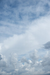 Beautiful sky background. Light blue and gray sky with a dramatic view of clouds. High quality photo