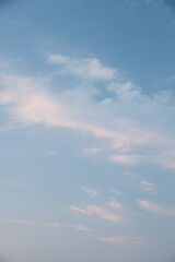Beautiful sky background. Light blue sky with soft white clouds. Perfect for sky replacement. High quality photo