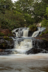 Fototapeta na wymiar Uma linda cachoeira que tem o nome de Maria Rosa, que fica localizada na cidade Ibiraci - MG