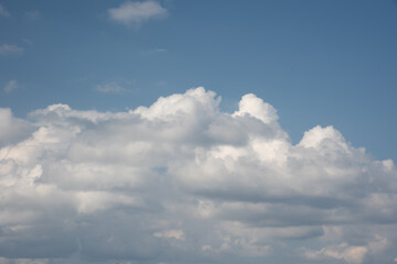 Obraz premium Beautiful sky background. Light blue sky with soft white and gray clouds. Perfect for sky replacement. High quality photo