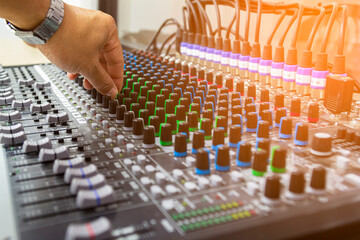 Fototapeta premium Sound recording studio mixing desk with engineer or music producer