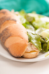 chichen sub sandwich with salad