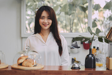 Young Asian woman is a owner of coffee shop