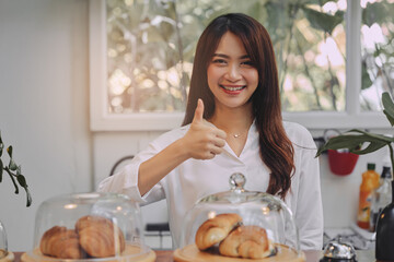 Young Asian woman is a owner of coffee shop