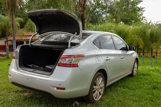 Cassilandia - Mato Grosso do Sul - Brazil - 12 05 2020: Silver nissan sentra car parked on the heel of the apor&eacute; river touristic point of cassilandia in the interior of brazil