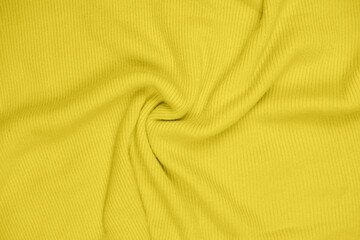 Fototapeta premium close up view of a sweater in trendy color of 2021 year illuminating yellow. apparel in fashionable color. 