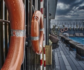 lifebuoys on the roof with a swimming pool
