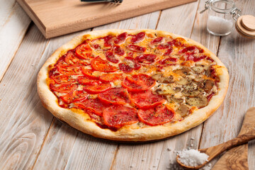 Assorted four seasons pizza on the wooden rustic table