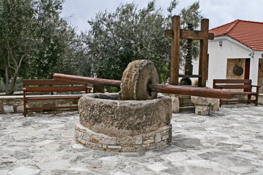 The traditional stone Olive Press and the wooden press
