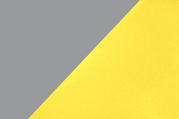 Abstract geometric paper background in yellow and gray color.