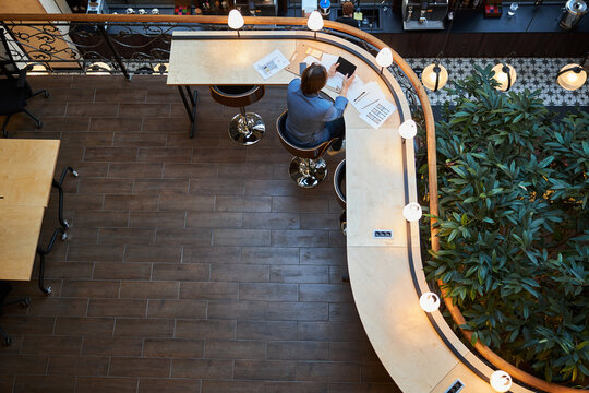 Lonesome businessman using his laptop at coworking space