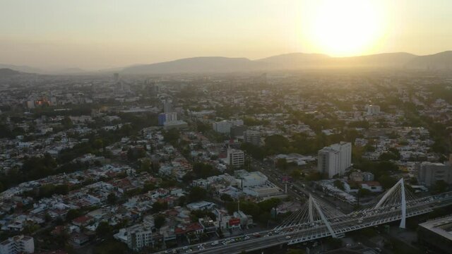 Aerial View of Guadalajara Streets During Sunset. Puente Matute Remus Bridge. Truck Left