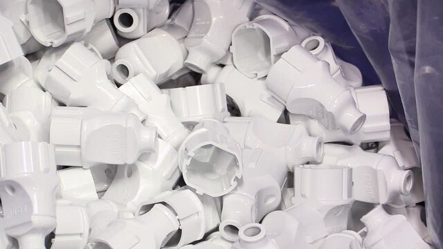 Newly Manufactured Plastic Pieces in Pile, Zoom out