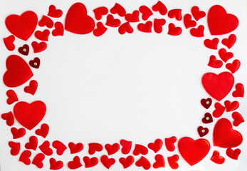 Frame of red hearts with space for text the centre on white background. Flat lay, top view Valentines Day background love concept.
