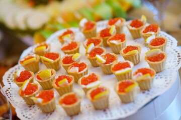 Delicious sandwiches with red caviar