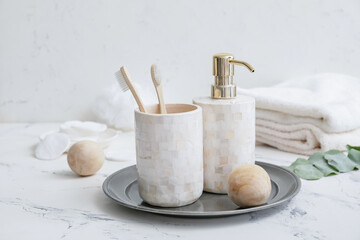 Set of bath accessories on light table