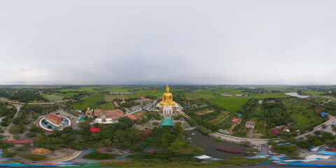 360 panorama by 180 degrees angle seamless panorama of aerial view of the Giant Golden Buddha in Wat Muang in Ang Thong district with paddy rice field near Bangkok. Urban town city, Thailand.