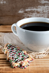 Cup of coffee with christmas tree cookies