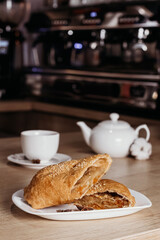 Apple strudel with coffee in a cafe. European cuisine.