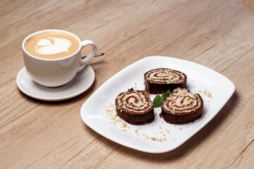 Serpentine cookies and coffee. Horizontal photo.