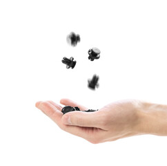 Hand holding black plastic clip for the car. Close up. Isolated on a white background