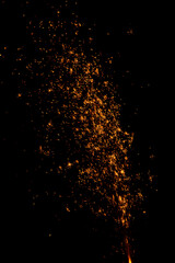 Fototapeta na wymiar blurry sparks from fireworks on black background