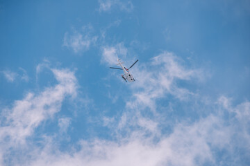 Fototapeta na wymiar Helicopter Clouds And Blue Sky