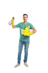 Young man with cleaning supplies on white background