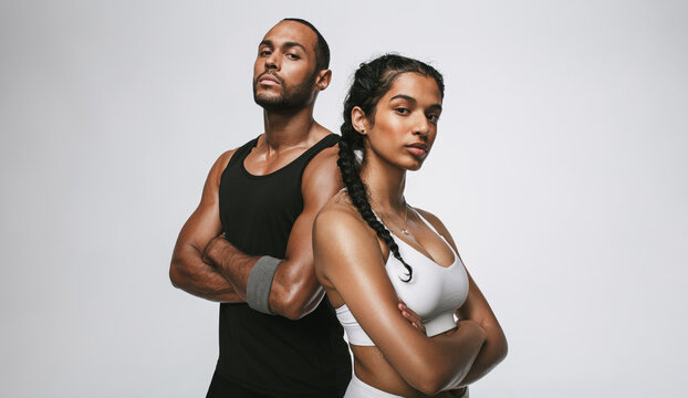 Fit Couple Standing On White Background