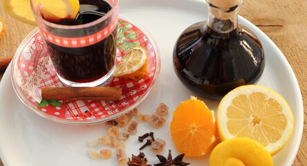 fresh mulled wine in a glass with orange and lemon