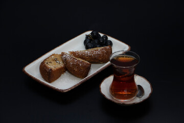 Turkish tea and cake grapes plate top