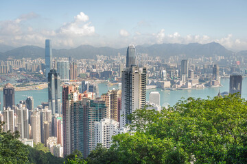 Fototapeta premium scenery of Hong Kong's Victoria Harbour and skyscraper buildings cityscape from Victoria Peak