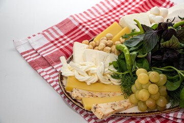 Cheese plate with grapes and nuts