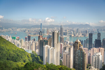 Fototapeta premium scenery of Hong Kong's Victoria Harbour and skyscraper buildings cityscape from Victoria Peak