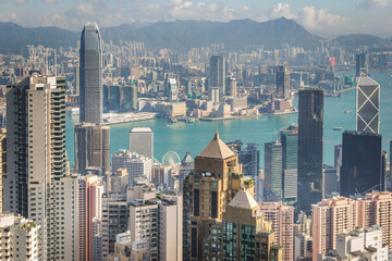 Fototapeta premium scenery of Hong Kong's Victoria Harbour and skyscraper buildings cityscape from Victoria Peak