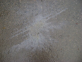 petrol spot on the pavement