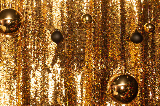 Golden balls on a golden background, new year