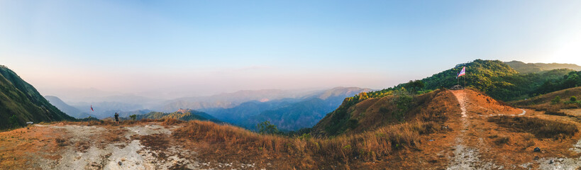 Panorama view on mountain in morning and cameraman enjoying the beautiful nature view. At Doi Thule, Tak province, Thailand