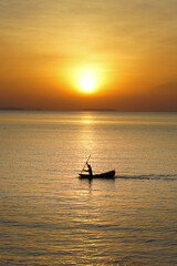 morning sun with fishermen at sea