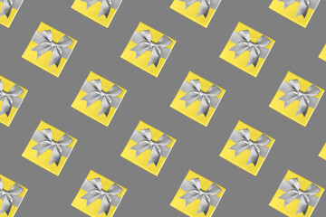 Gift box, Illuminating and Ultimate Gray. Colors of the year 2021. Top view, copyspace, minimalism. The concept of the holiday, gift, surprise, new year, christmas.