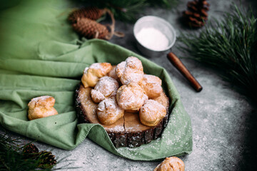 Profiteroles with custard on the table. New Year's dessert
