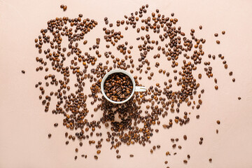 Cup with coffee beans on color background