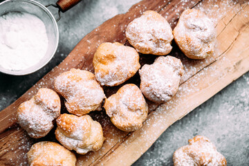 Profiteroles with custard on the table. New Year's dessert