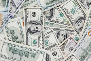 American banknotes 100 dollars. Background from dollars