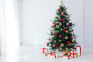 New year decorated Christmas tree with gifts in the house